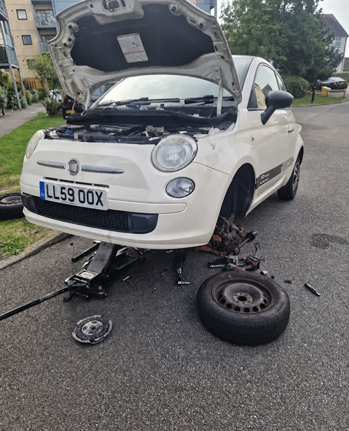 Mobile mechanic carrying out a clutch replacement on a customer's Fiat in Leicester